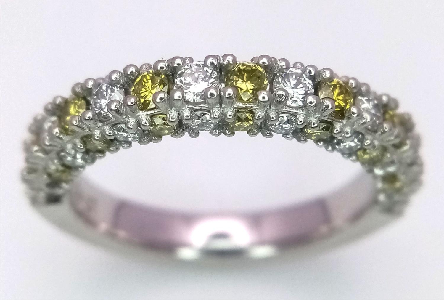 A Platinum White and Yellow Diamond Three-Sided Half Eternity Ring. Size L. 6.3g total weight. - Image 2 of 9