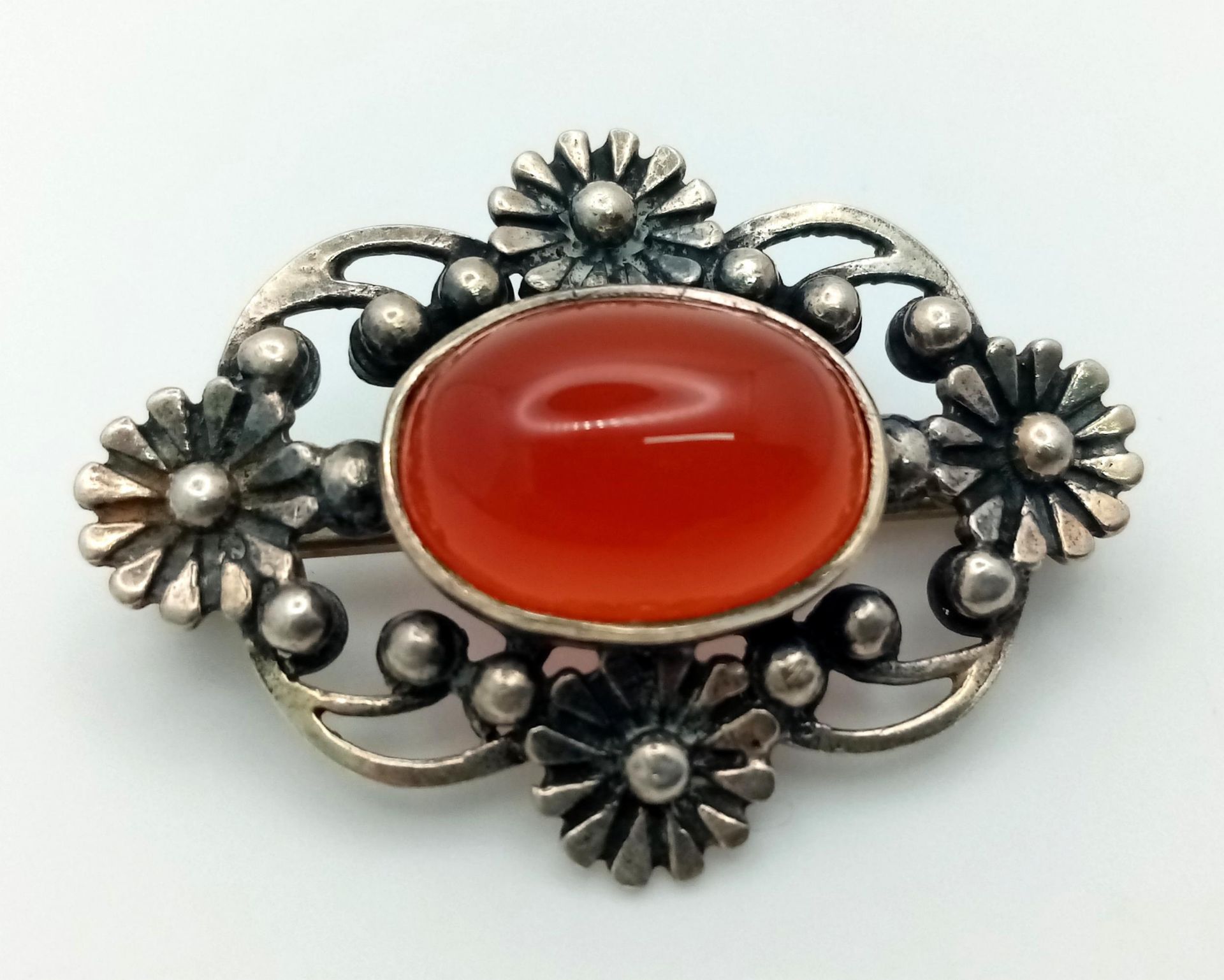 A Vintage or Antique Silver Carnelian Cabochon Brooch. 3.5cm Width. Set with a 1.5cm Oval Cut