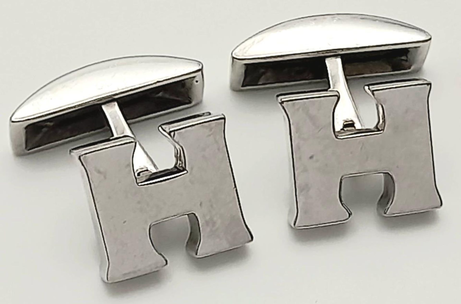 A 18K WHITE GOLD HIRSH CUFFLINKS 11.5G SC 9061