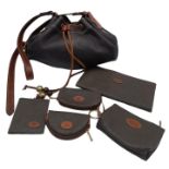 A Mulberry Brown Drawstring Bag. Leather exterior with gold-toned hardware, adjustable strap and