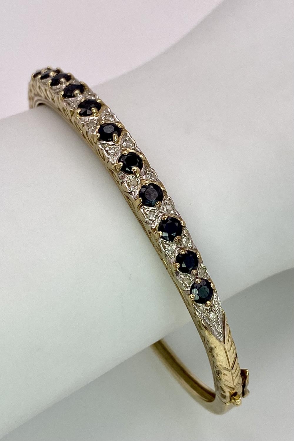 A 9K YELLOW GOLD DIAMOND & SAPPHIRE SET BANGLE 10.4G , 55mm x 63mm diameter. SC 9005 - Image 4 of 8