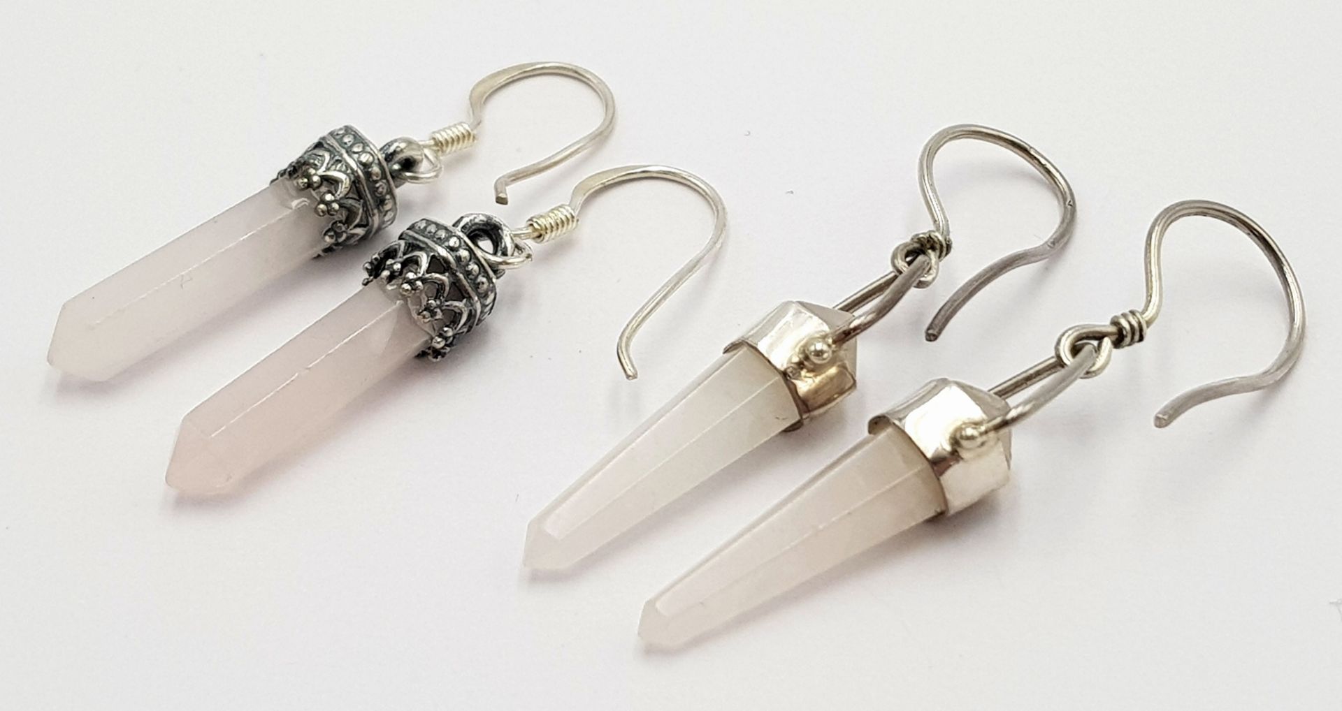 Two Pairs of Middle Eastern Designed Sterling Silver and Rose Quartz Pencil Cut Pointed Earrings.