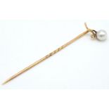 A Vintage 9K (tested) Yellow Gold Stick Pin with Pearl Decoration. 5.5cm. 1g total weight.