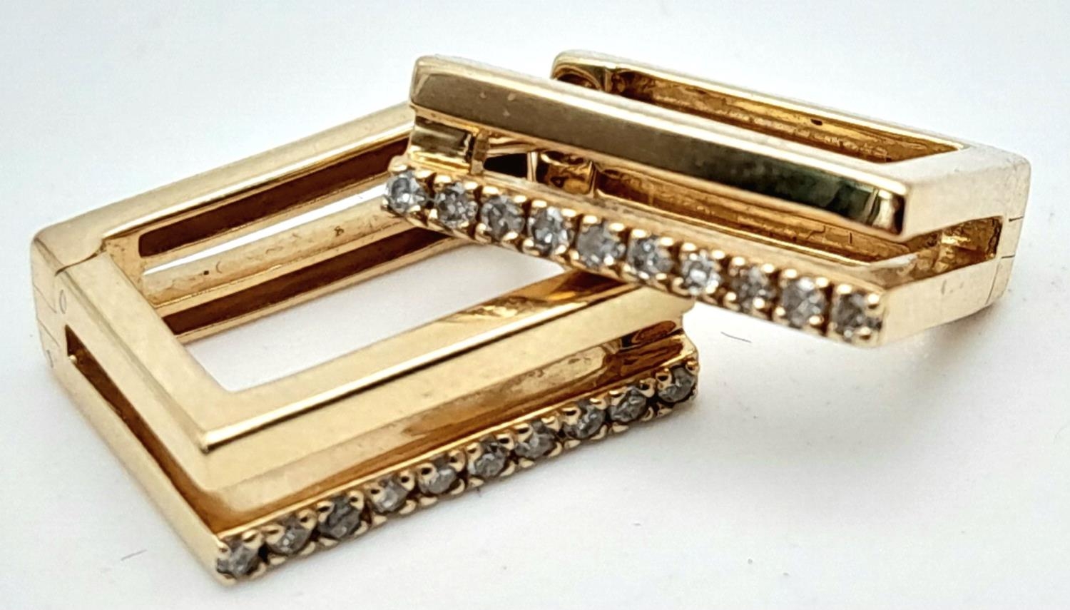 A Pair of 14k Gold and Diamond Massika Designer Rectangular Earrings. 2.2g total weight.