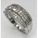 A 9K White Gold Mixed Cut Diamond Ring. Five rows of, square, round and baguette cut diamonds.