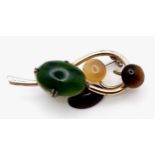 A Magical, Music Note Styled Multi-Gemstone Brooch. Jade, tigers eye, moonstone and agate hit the