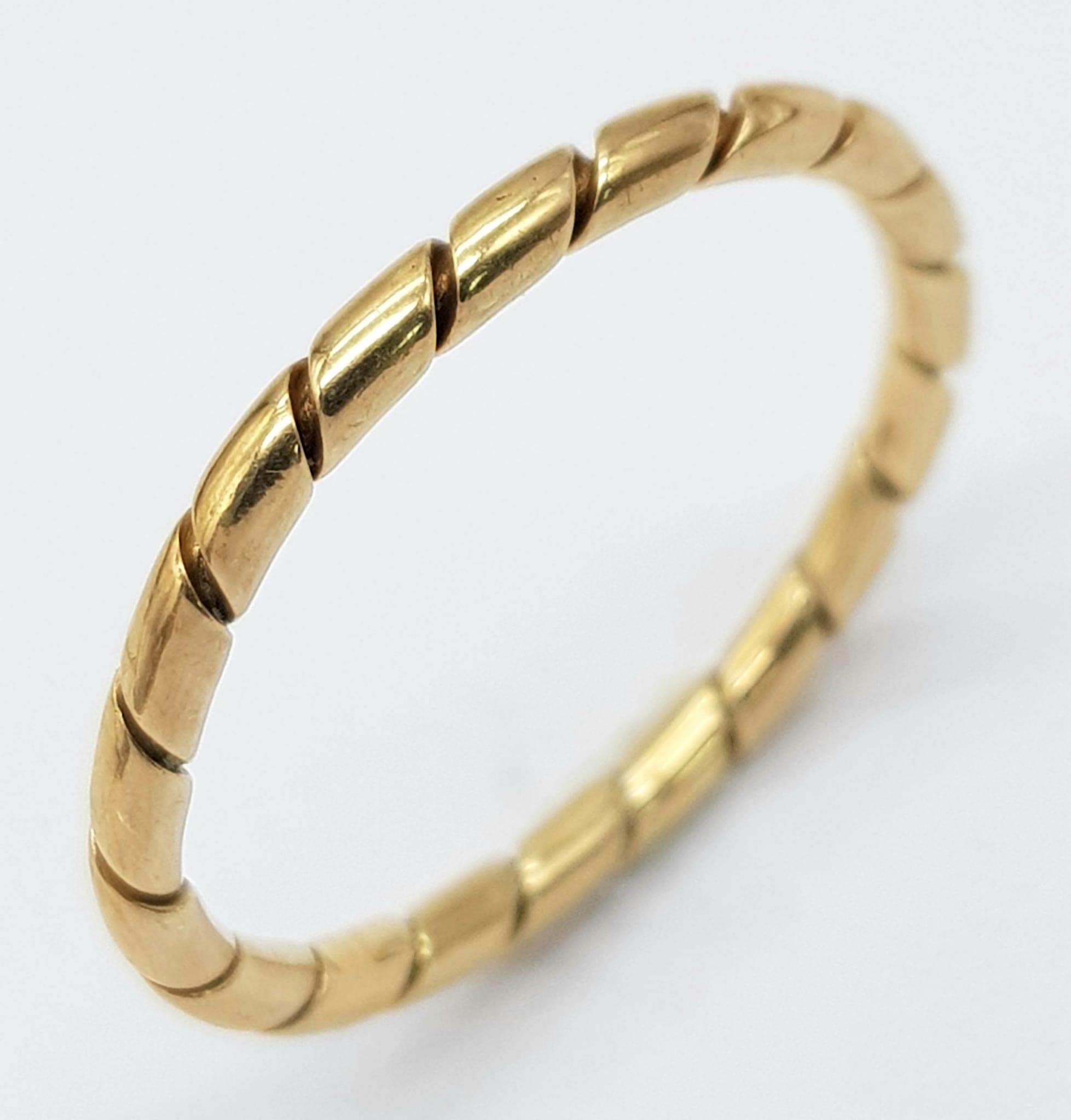 A Vintage 9K Yellow Gold Thin Band Ring with Diagonal Ridged Design. Size K. 1.33g. 2mm