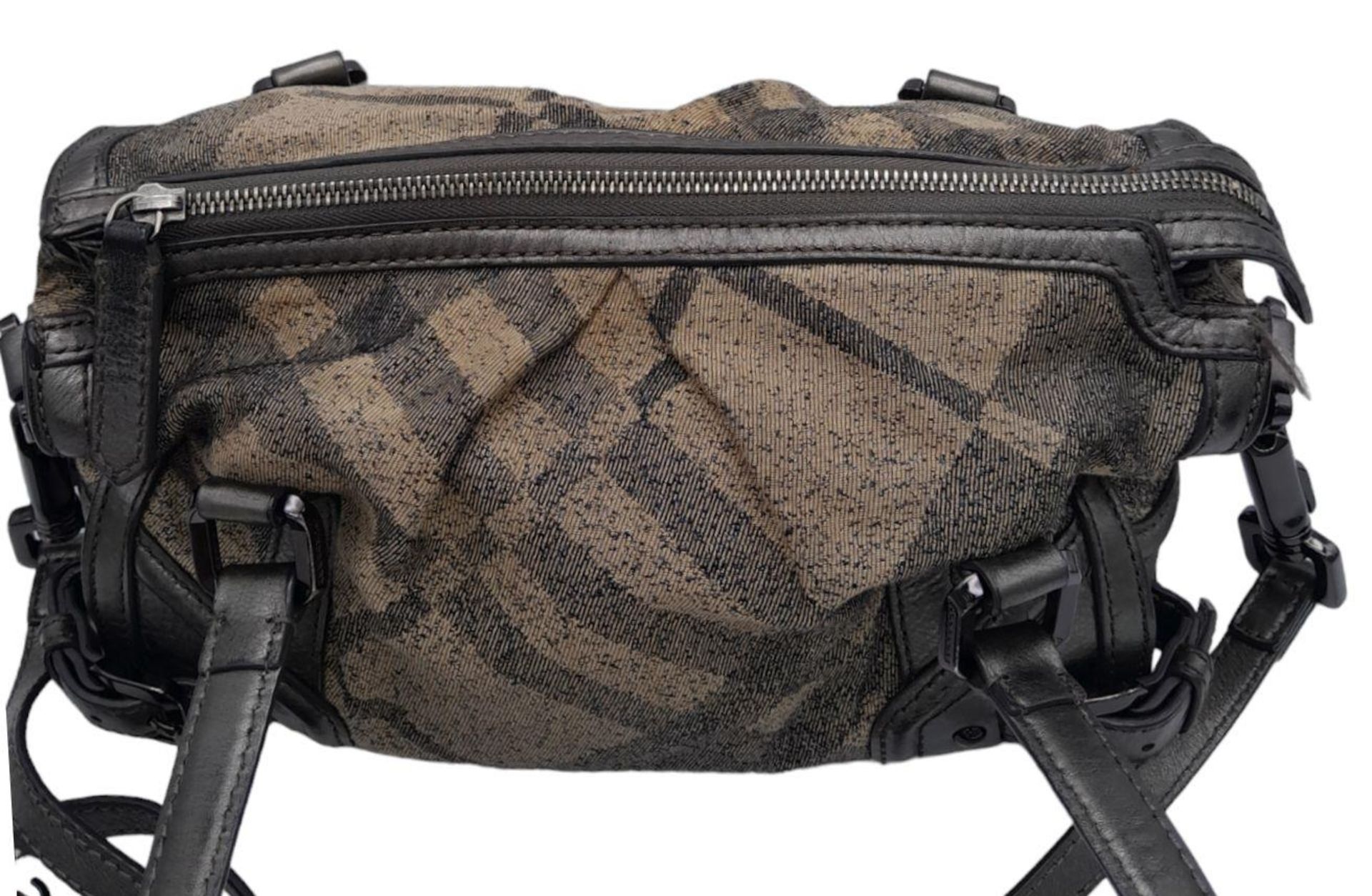 A Burberry Metallic Grey Smoke Check Bag. Canvas exterior with leather trim, leather straps, black- - Image 5 of 9