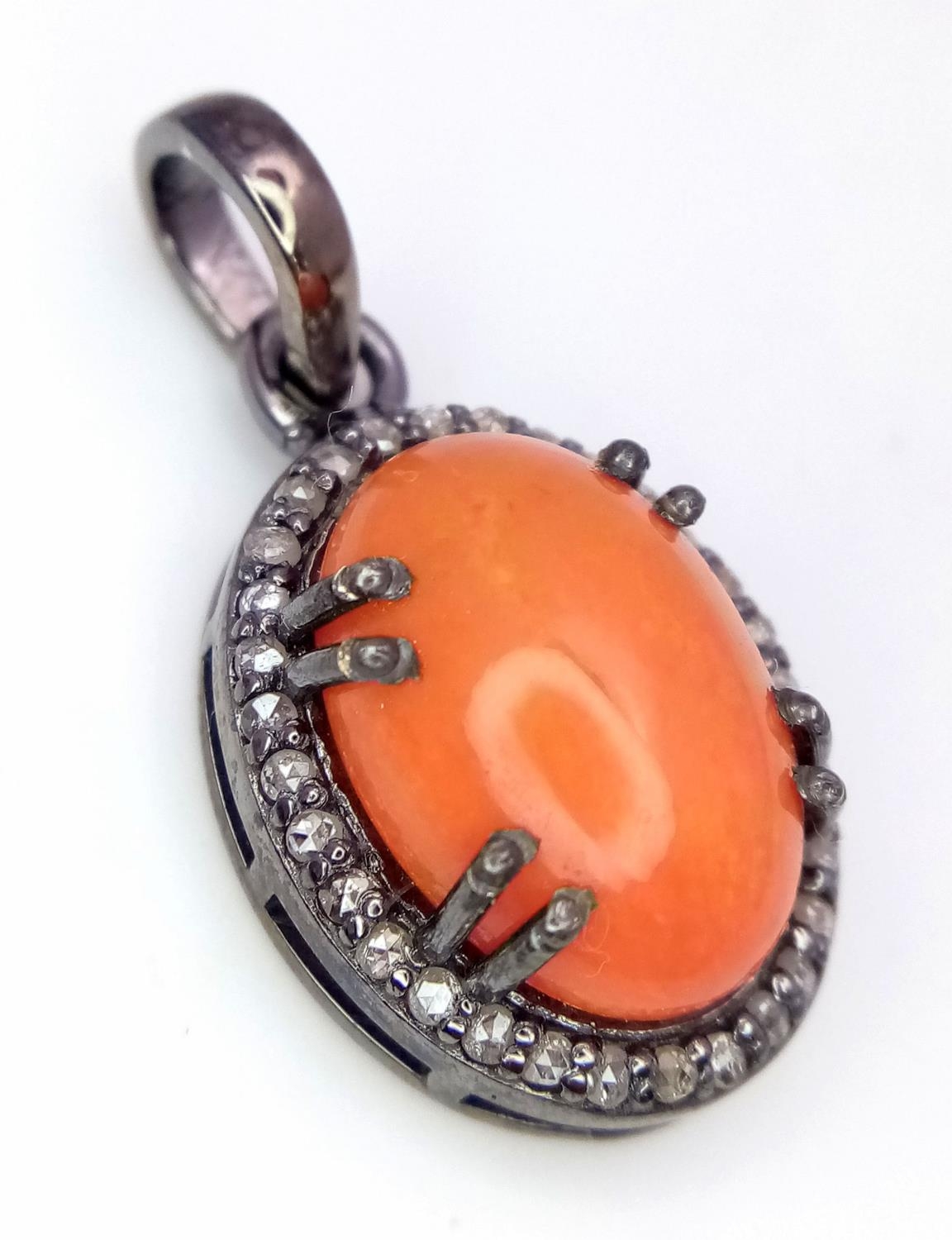 An Australian Fire Opal Cabochon Pendant with a Diamond Surround. 3cm. Ref: CD-1339