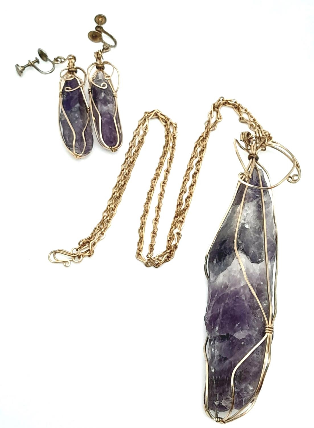 A Yellow metal amethyst geode large wire caged necklace with matching earrings with non-pierced