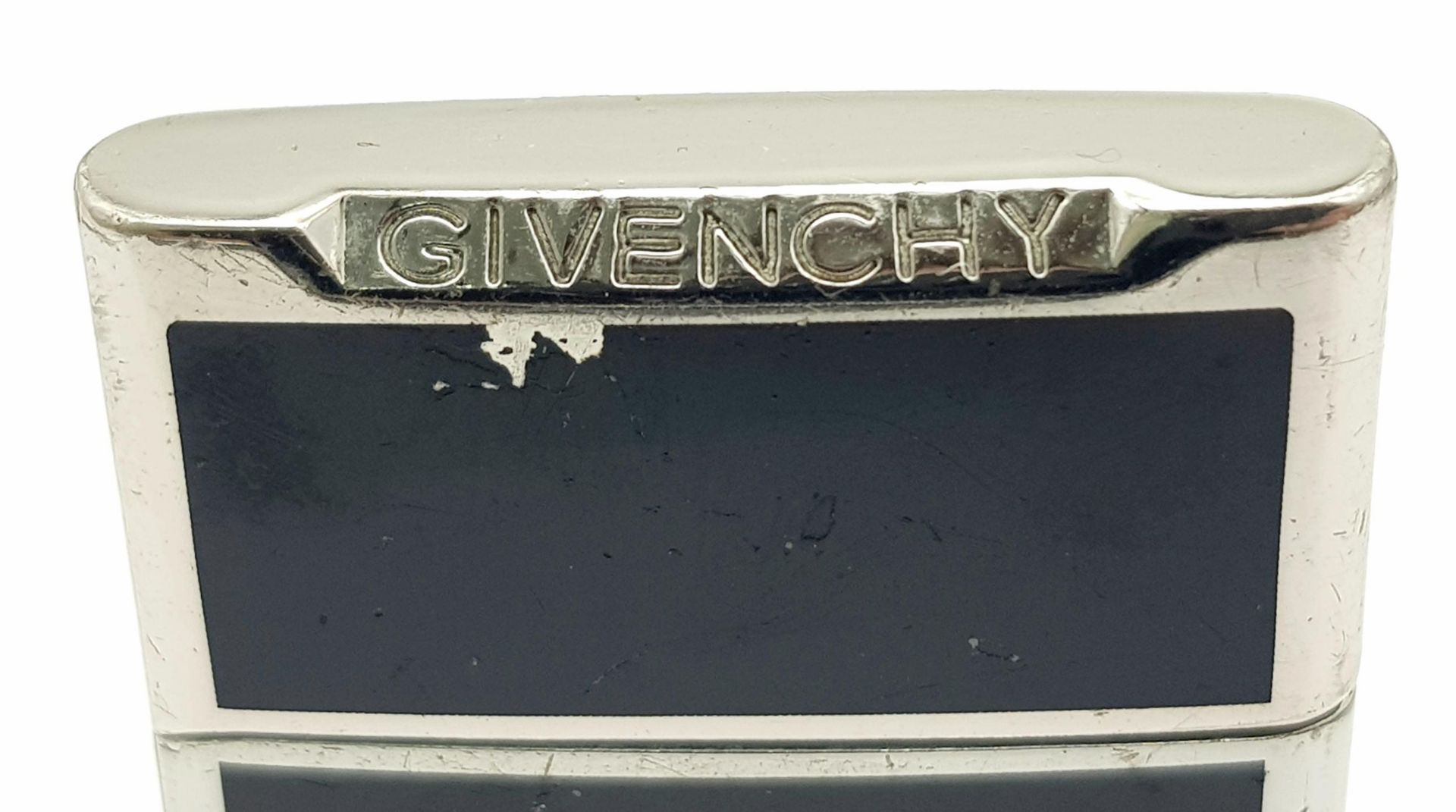 A Vintage Givenchy Black Enamel Lighter. Needs gas and flint. 5cm x 3.5cm. UK sales only. - Image 3 of 5