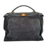 A Fendi Grey Peekaboo Bag. Suede exterior with leather trim, single leather handle, gold-toned