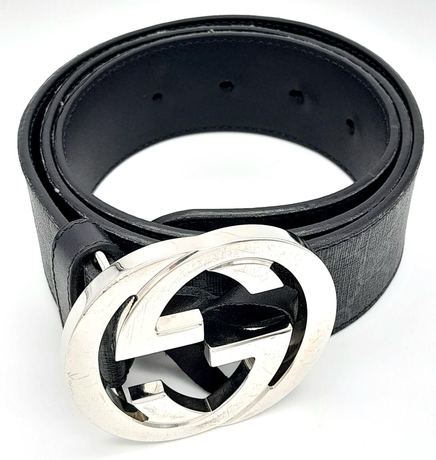 A Gucci Black with Grey Monogram Men's GG Belt. Silver-toned hardware. Approximately 104.5cm length, - Image 2 of 7