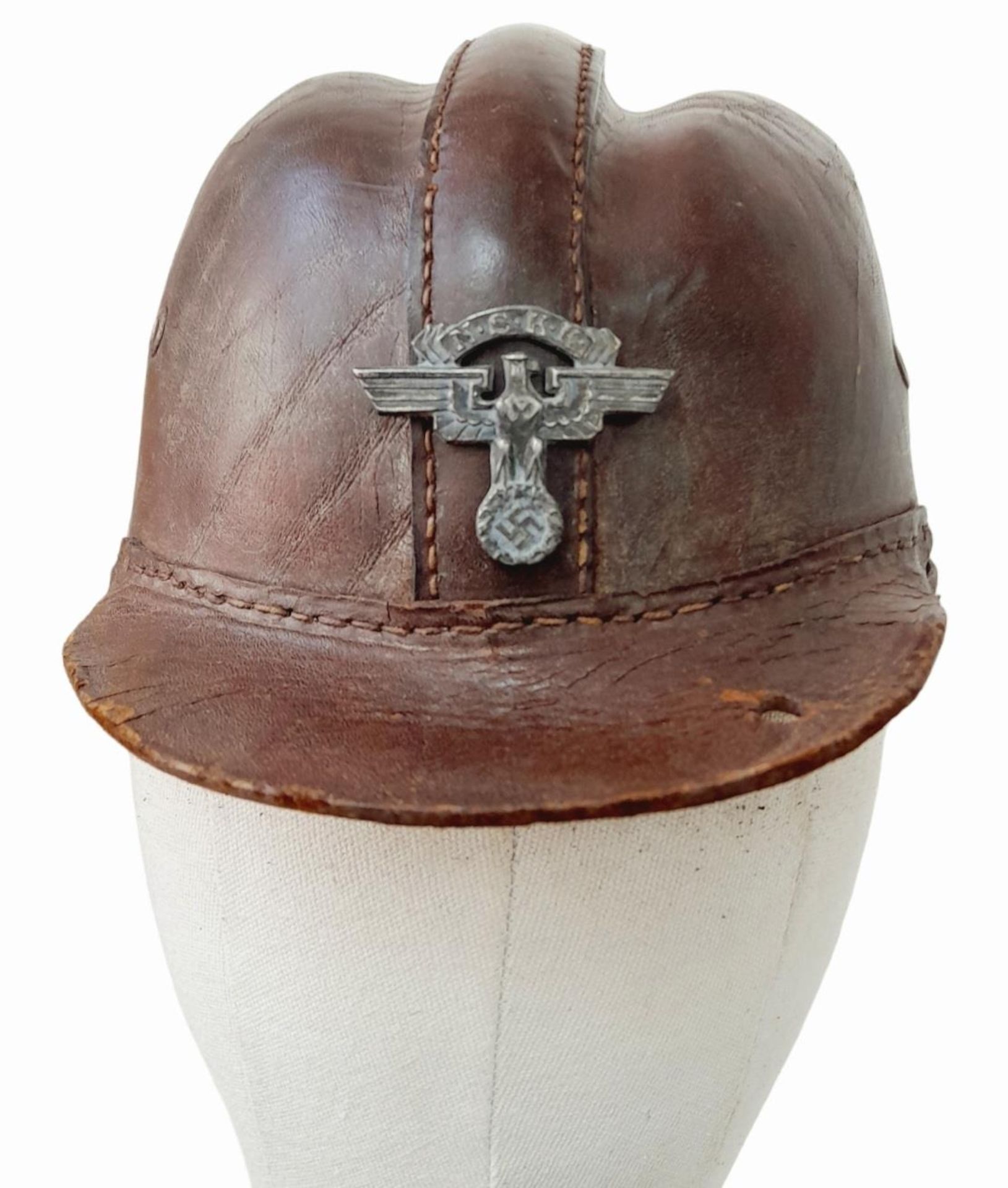 Early 1930’s German Motorcycle Crash Helmet and liner with an NSKK Badge on the front.