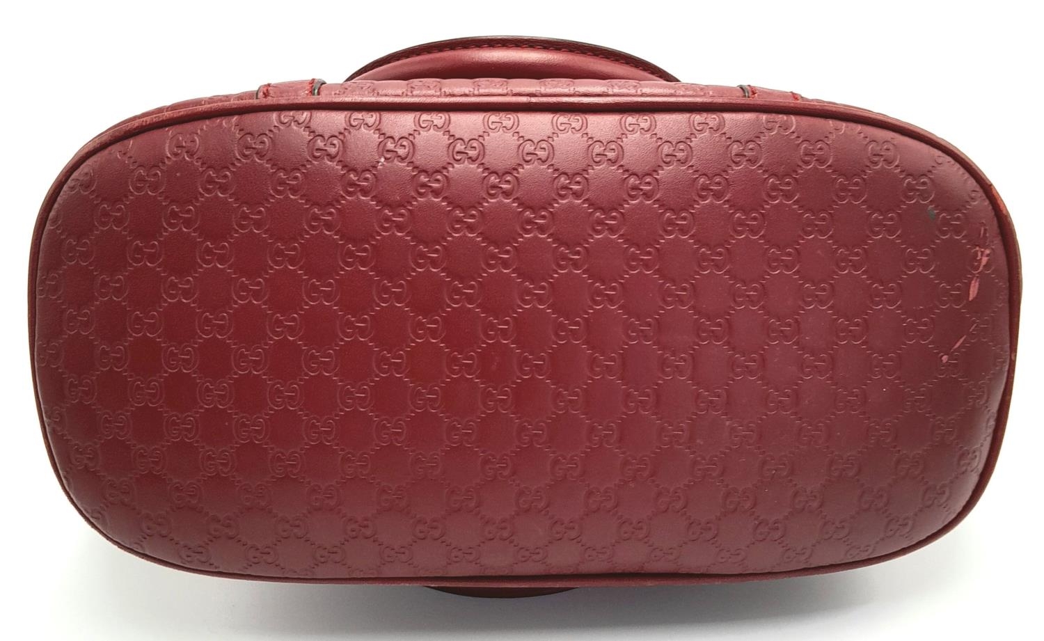 A Gucci Red Guccissima Dome Bag. Monogramed leather exterior with gold-toned hardware, two rolled - Image 3 of 10