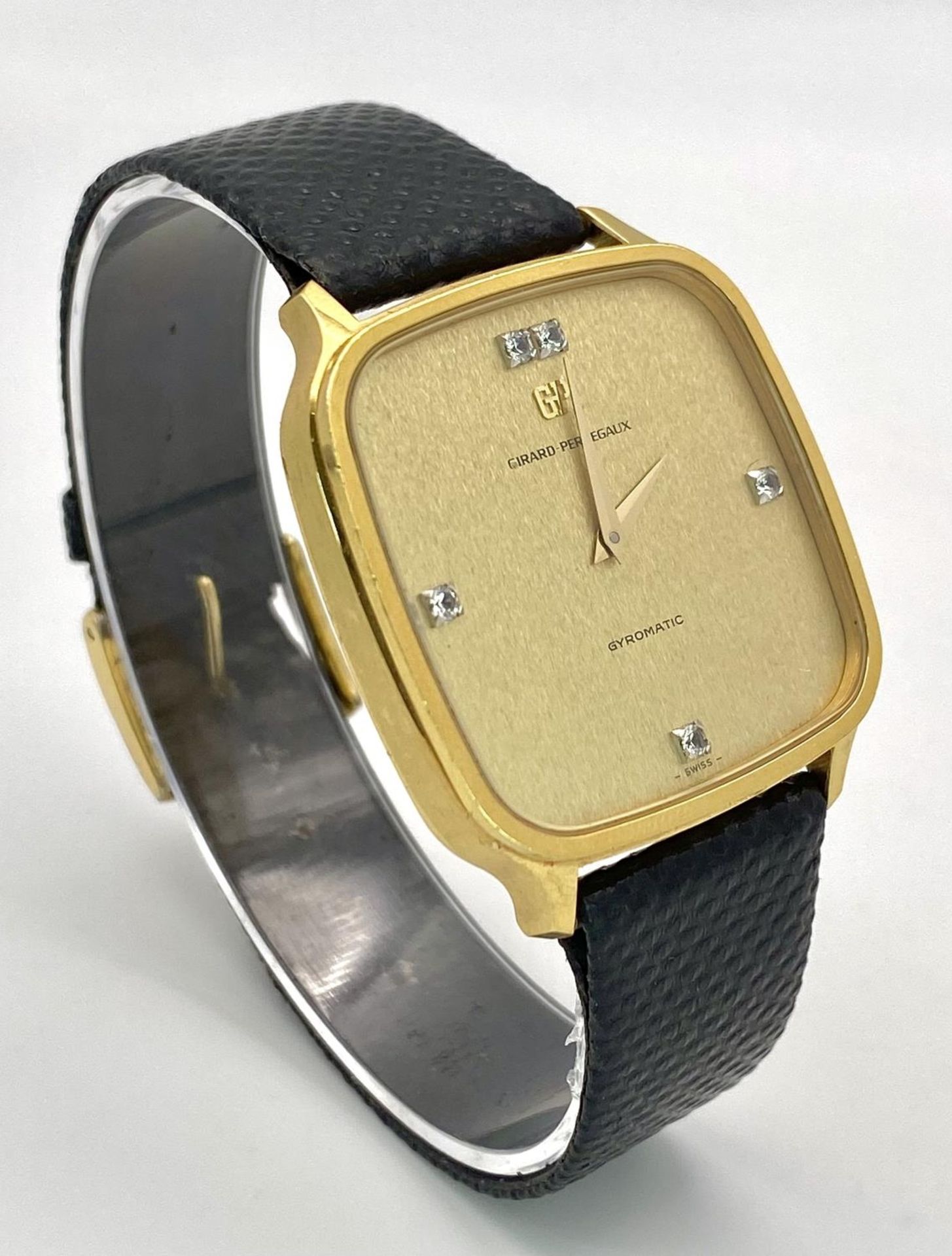 A Girard Perregaux Gold Plated Gyromatic Gents Watch. Black leather strap. Gold plated case -