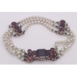 An Antique 9K Gold (tested), Garnet and Pearl Bracelet. Different cuts of rich garnet gemstones