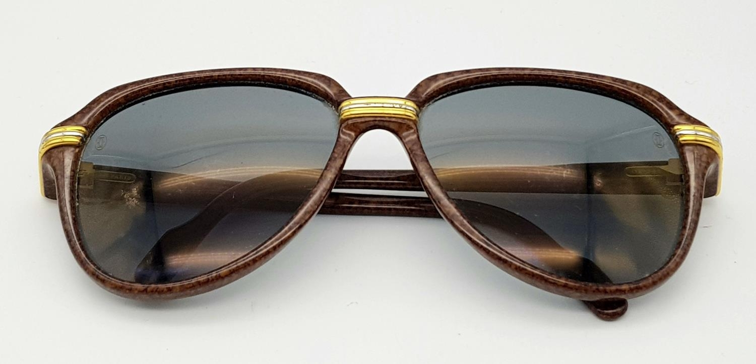 A Pair of Cartier Brown Vitesse Sunglasses. Elegant marble carbon frame with Cartier watermarks on - Image 5 of 9