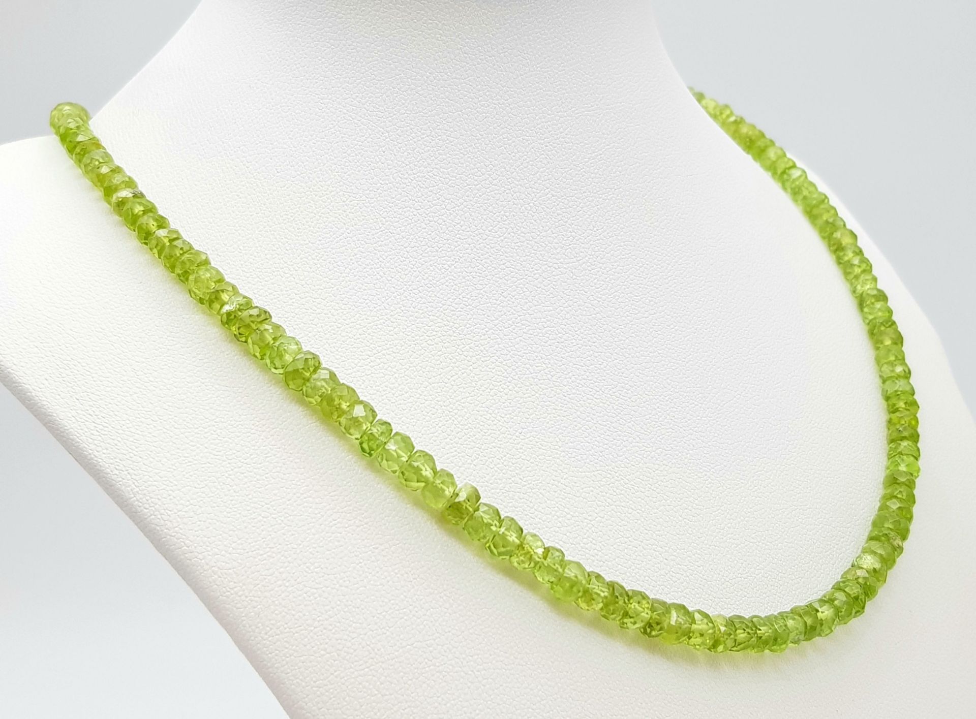A Peridot Gemstone Tennis Bracelet with a Peridot Rondelle Necklace. Both with silver clasps. - Image 4 of 6