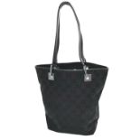 A Gucci Black Monogram Tote Bag. Canvas exterior with leather trim, two leather straps and silver-