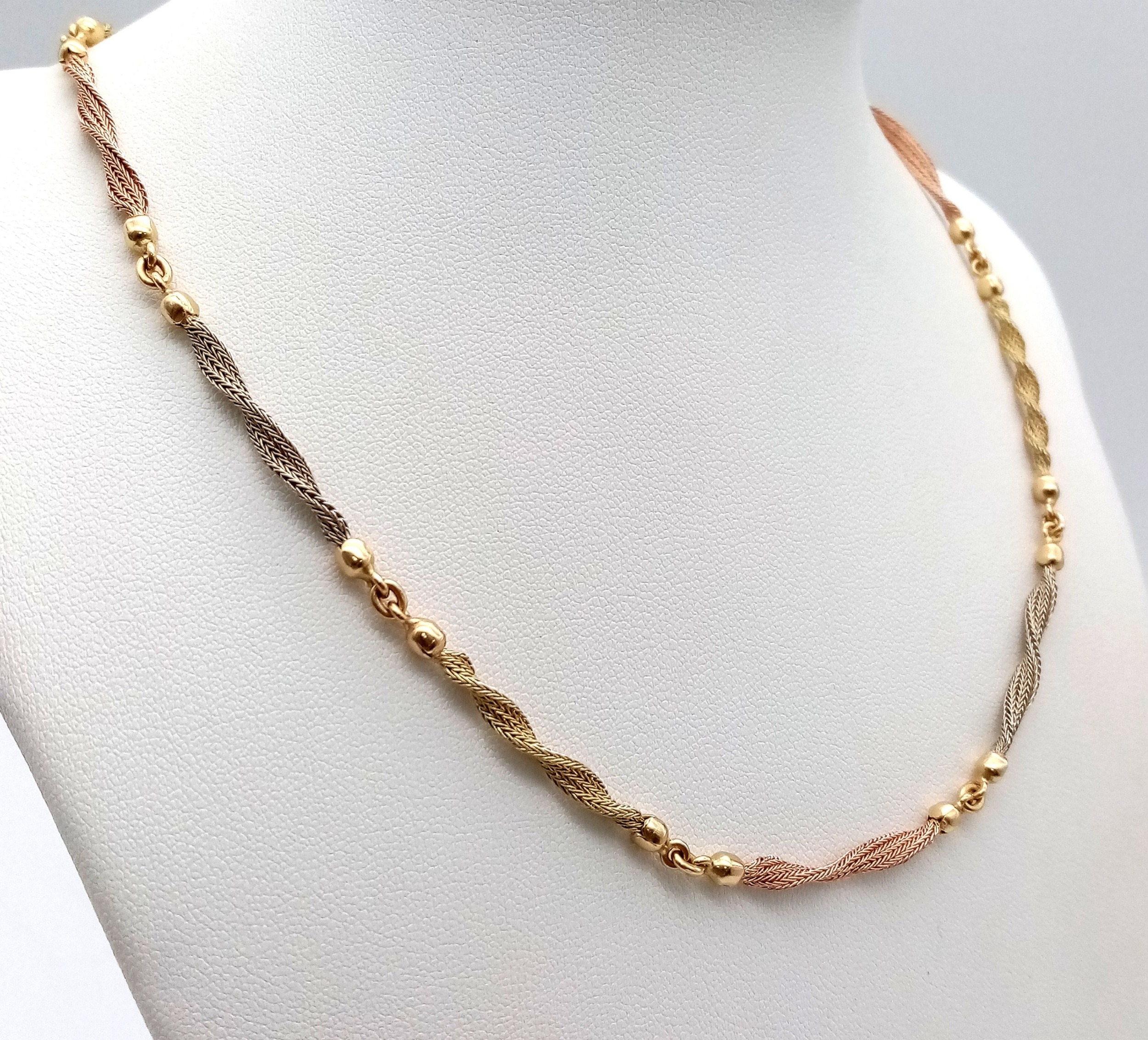 A Beautiful Italian 14K Yellow and Rose Gold Twist Necklace. Ten bars of alternating coloured gold - Image 2 of 6