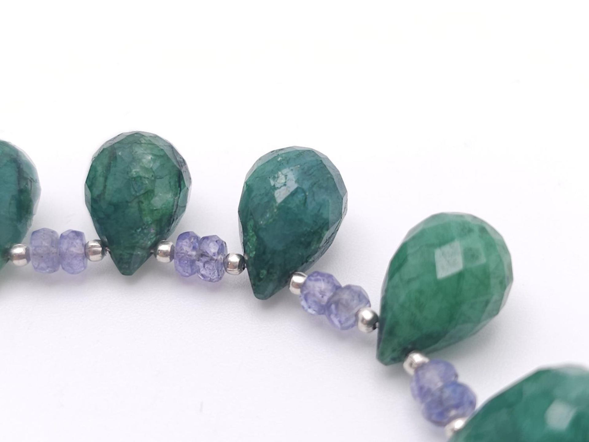 A 125ctw Tanzanite Gemstone Single Strand Necklace with Emerald Drops. 925 Silver Clasp. 42cm. - Image 2 of 4