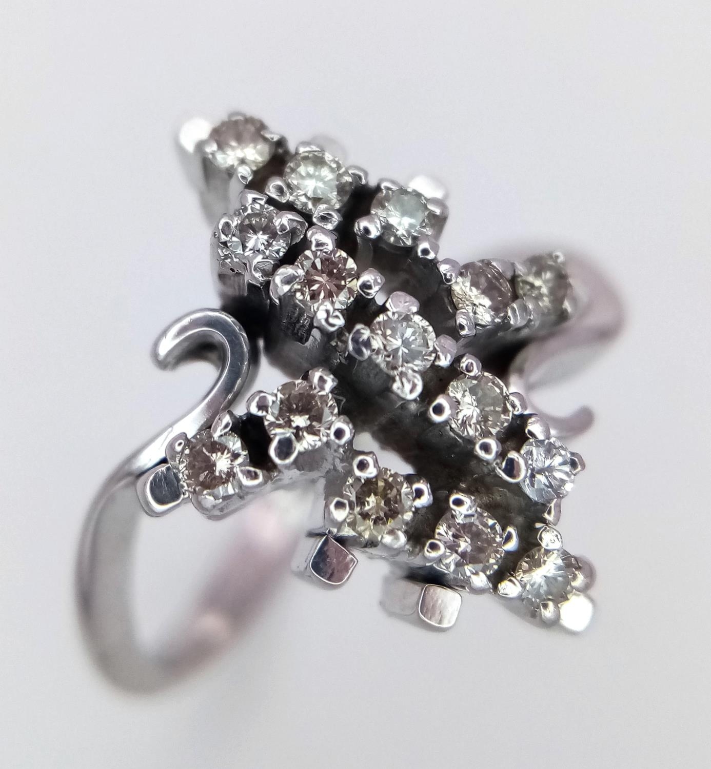 AN 18K WHITE GOLD DIAMOND FANCY CLUSTER RING. 0.25ctw, size O, 4.6g total weight. Ref: SC 9036