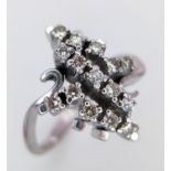 AN 18K WHITE GOLD DIAMOND FANCY CLUSTER RING. 0.25ctw, size O, 4.6g total weight. Ref: SC 9036