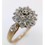 A 9K YELOW GOLD DIAMOND RING IN THE FLORAL DESIGN 0.20CT 3.6G SIZE O. SC 9003