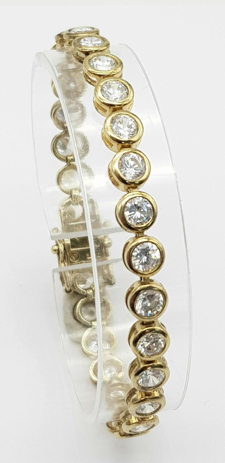 A Gilded 925 Silver Cubic Zirconia Bracelet. 18.5cm length, 16.4g total weight.