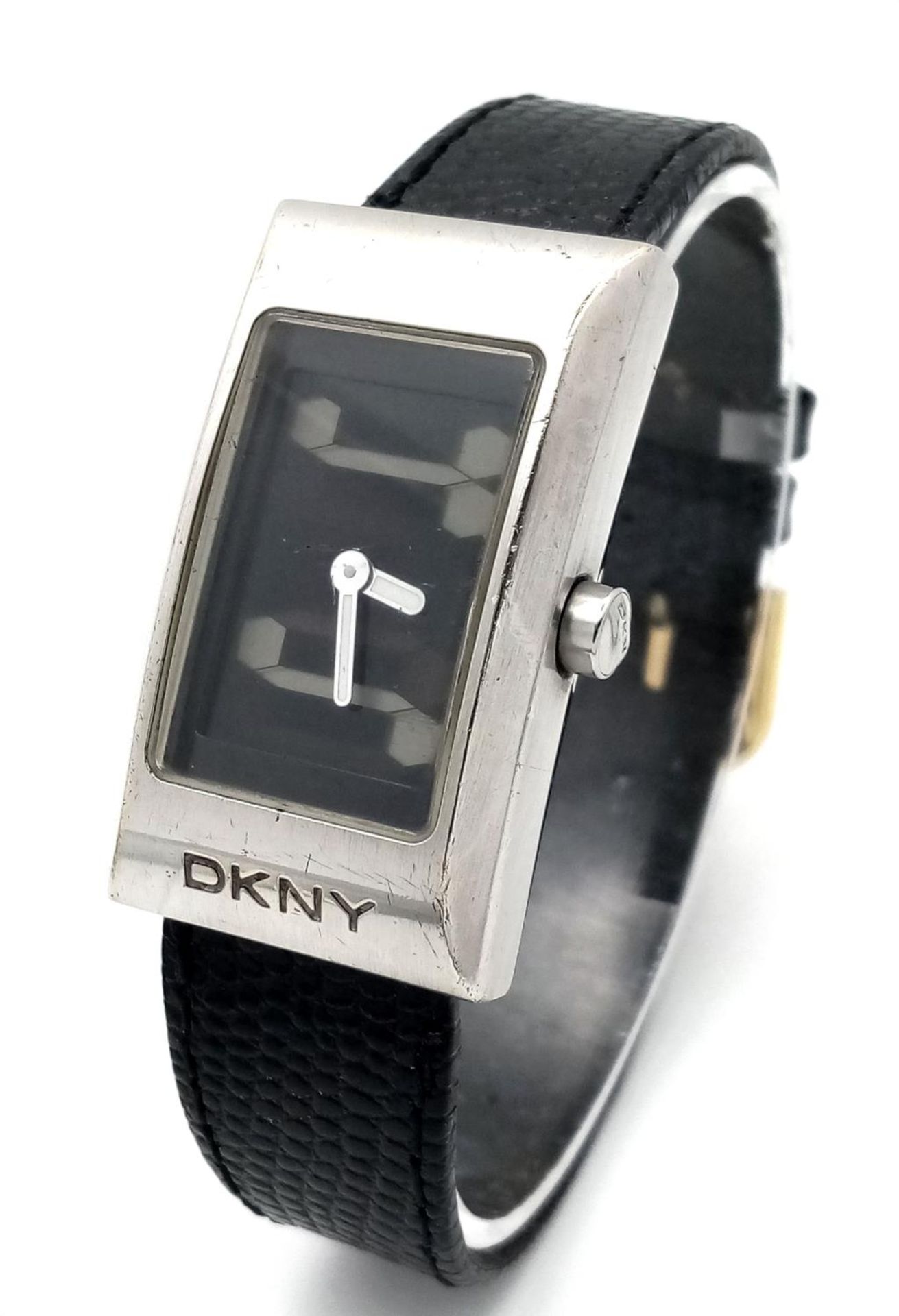 A DKNY Quartz Ladies Watch. Black leather strap. Stainless steel case - 24mm. Analogue/digital dial.