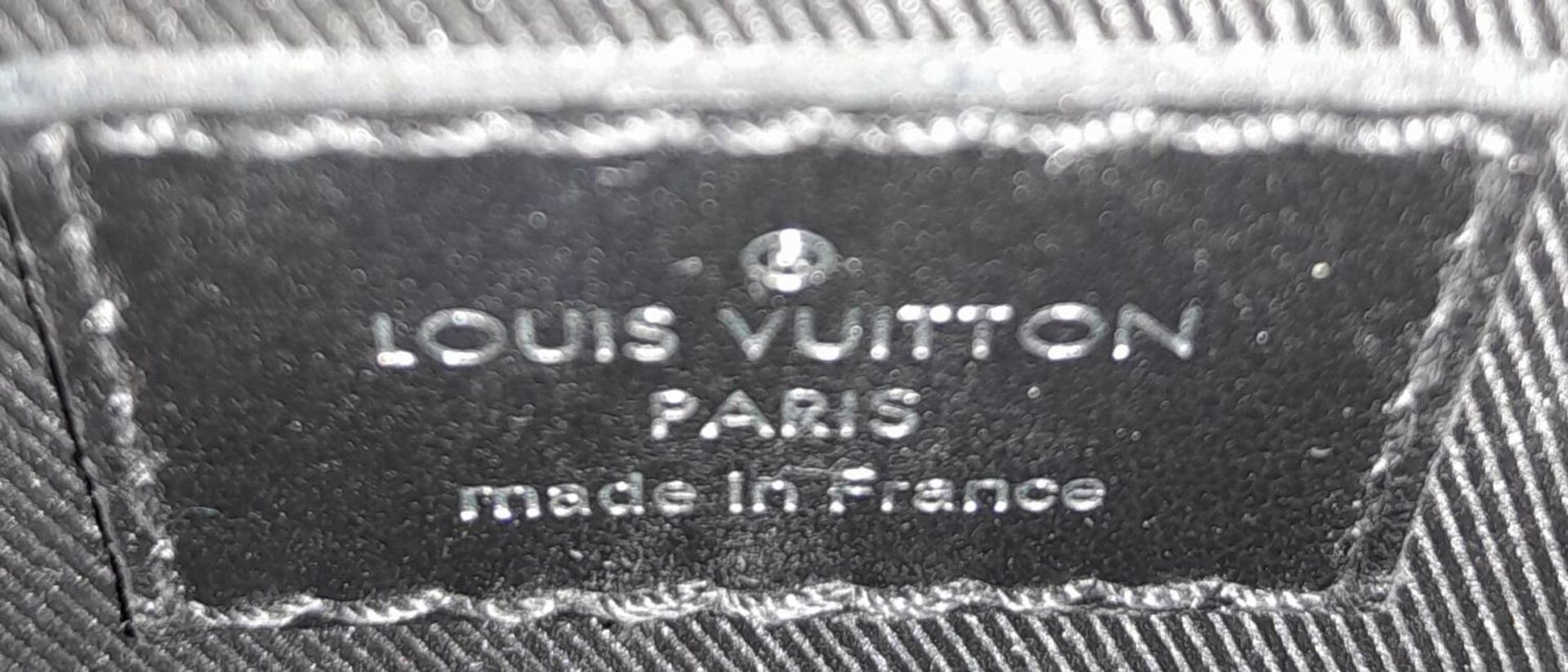 A Louis Vuitton Black Eclipse Trunk Messenger Bag. Monogramed canvas exterior with black-toned - Image 8 of 10