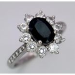 A 18K (TESTED AS) WHITE GOLD DIAMOND & SAPPHIRE CLUSTER RING 0.50CT DIAMONDS & 1CT OVAL SAPPHIRE 4.