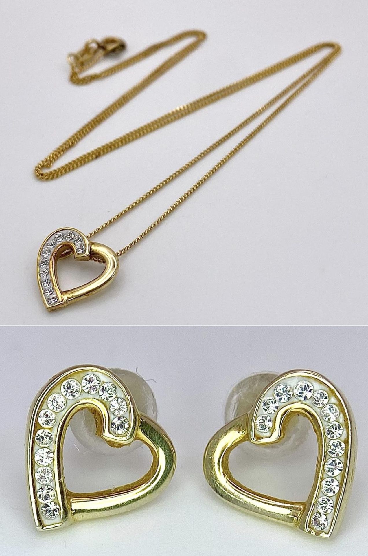 An Evoke Gilded Silver and Zircon Earring and Necklace Set. In original packaging.