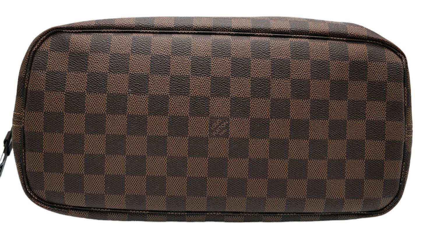 A Louis Vuitton Neverfull Damier Ebene Bag. Coated canvas exterior with leather trim, gold-toned - Image 4 of 12