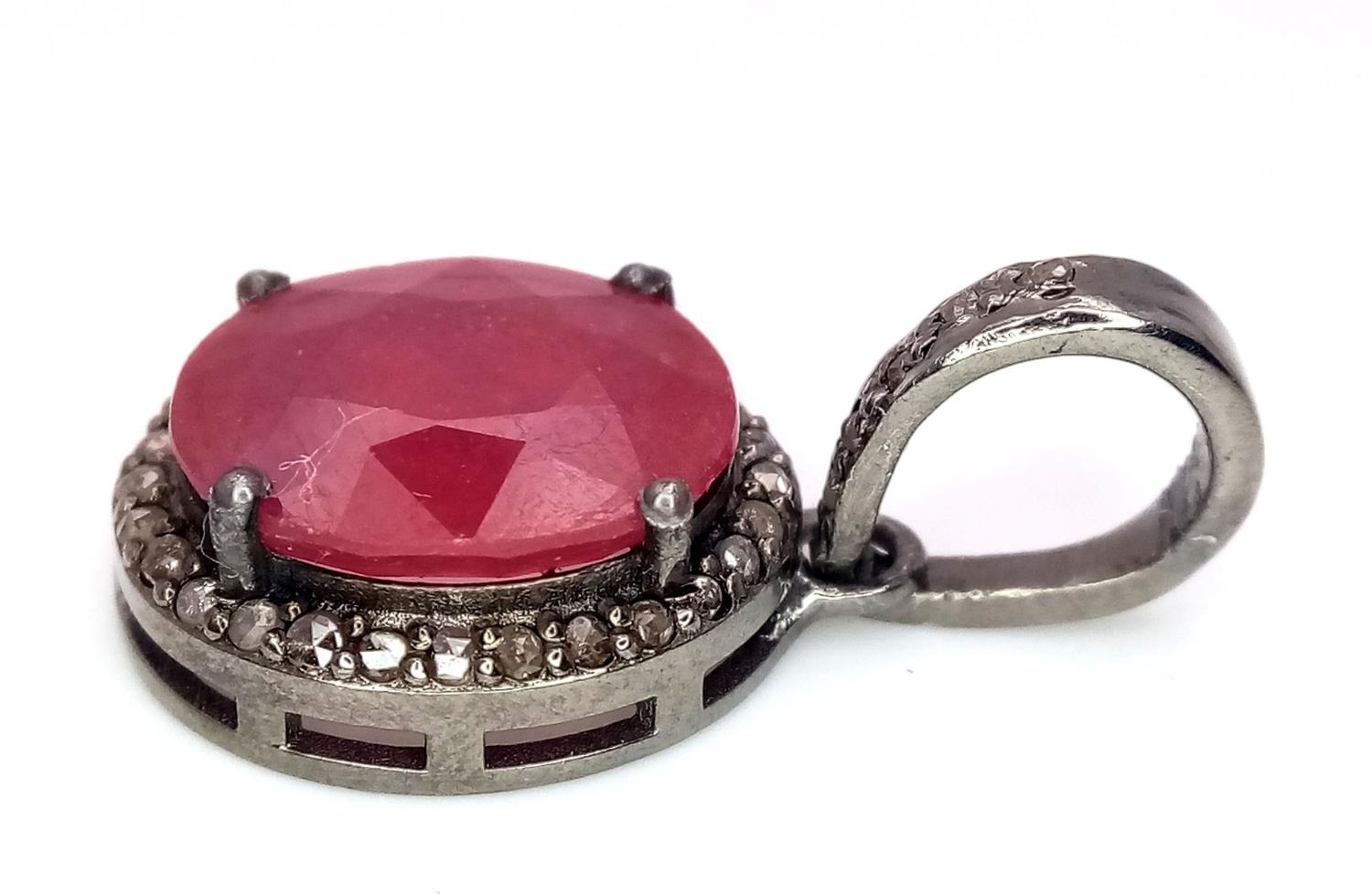 A Ruby and Rose Cut Diamond Pendant. Oval cut. Set in 925 Sterling Silver. 4.90ct ruby. Diamonds - - Image 4 of 4