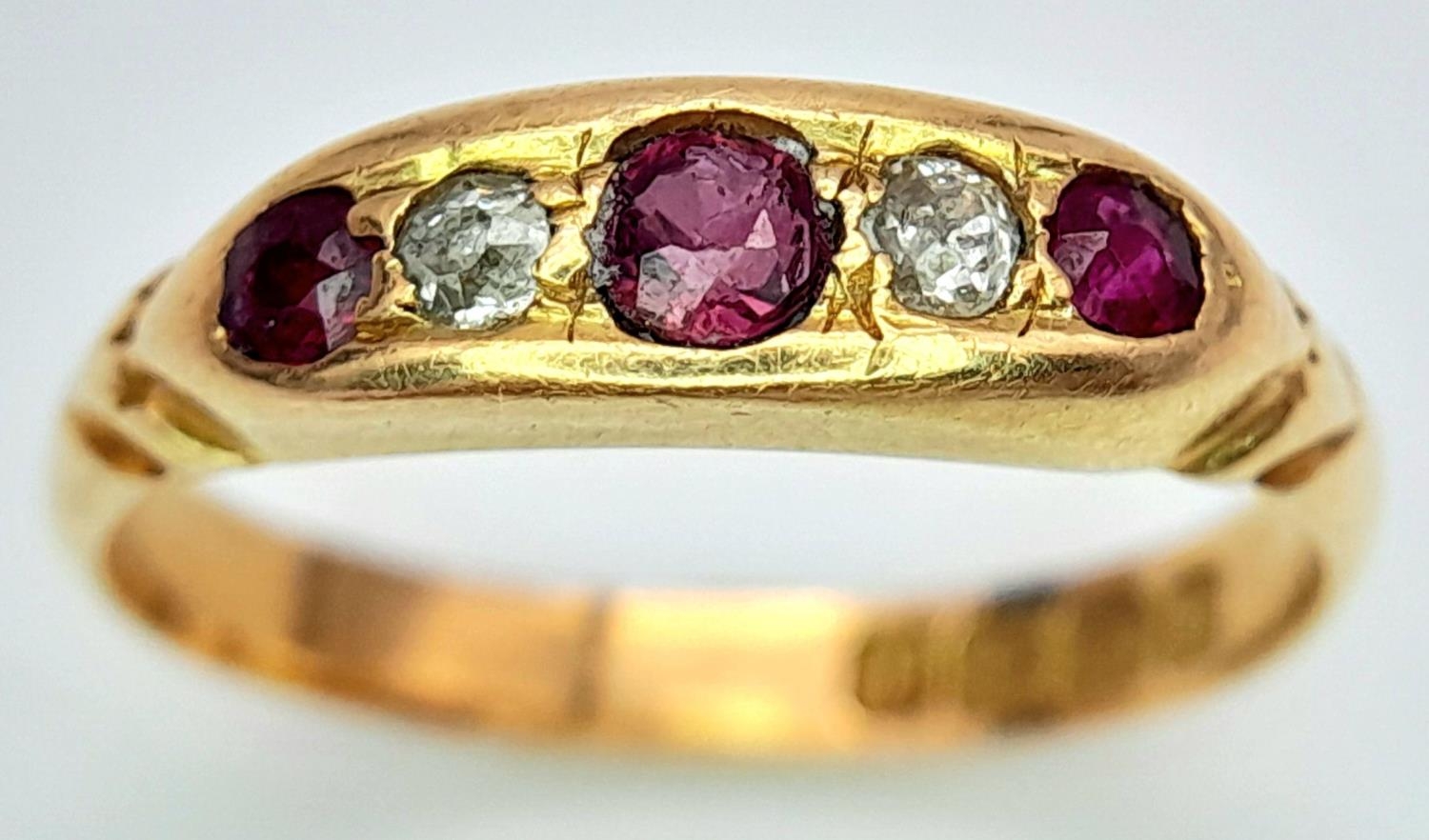 An Antique 18K Yellow Gold Ruby and Diamond Ring. Size K/L, 2.78g total weight.