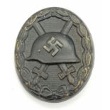 WW2 German 3 rd Class Wound Badge in Black Representing Iron & Award Certificate to a soldier in the