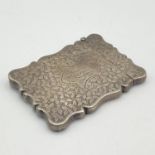 An Edwardian Sterling Silver Card Case. Floral engraving with monogram cartouche. Birmingham