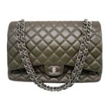 A Chanel Green Jumbo Classic Double Flap Bag. Quilted leather exterior with silver-toned hardware,