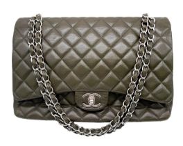 A Chanel Green Jumbo Classic Double Flap Bag. Quilted leather exterior with silver-toned hardware,