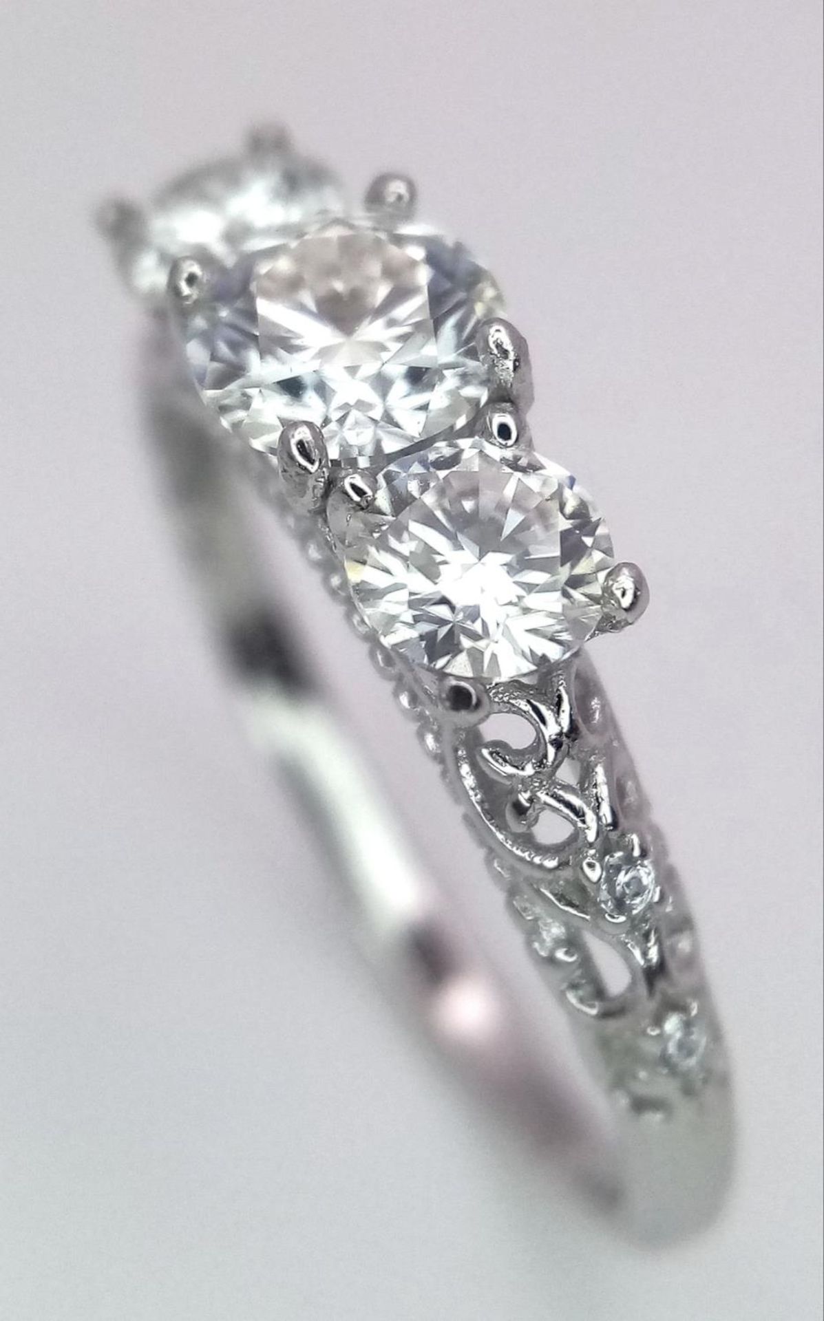 A 0.5ct Three Stone Moissanite, 925 Silver Ring. Size N. Comes with a GRA cert. - Image 3 of 6