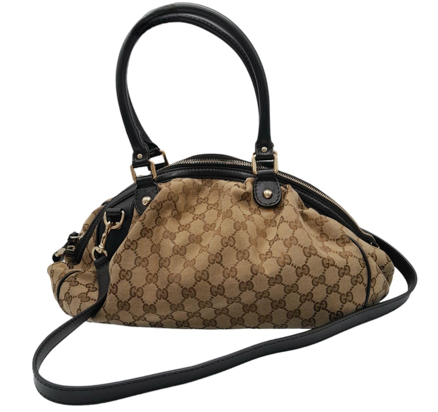 A Gucci Monogram Sukey Satchel Bag. Canvas exterior with leather trim, two rolled leather handles, - Image 3 of 9