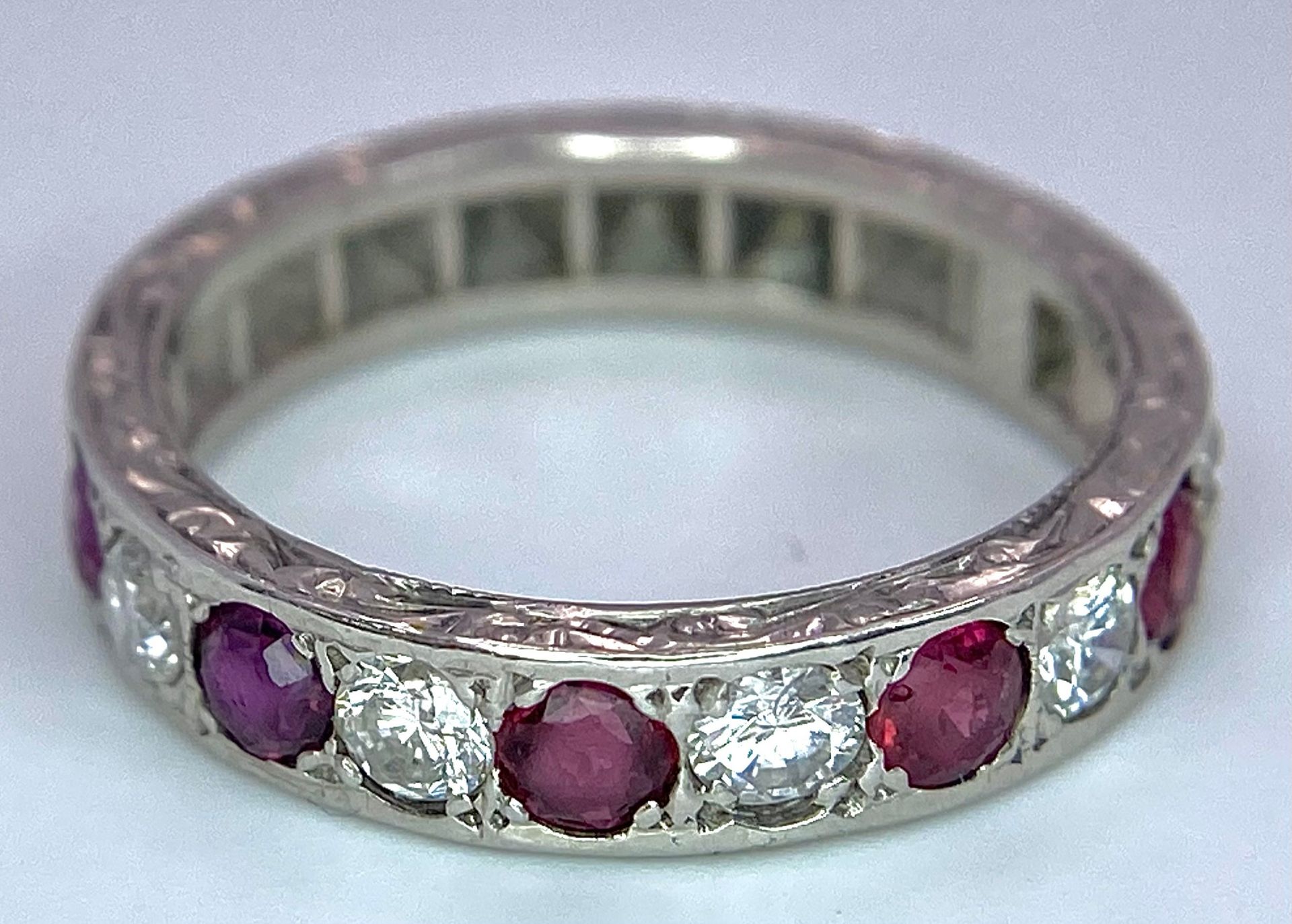 AN 18K WHITE GOLD DIAMOND & RUBY BAND RING. 0.25ctw, size L, 4.1g total weight. Ref: SC 9038 - Image 3 of 4