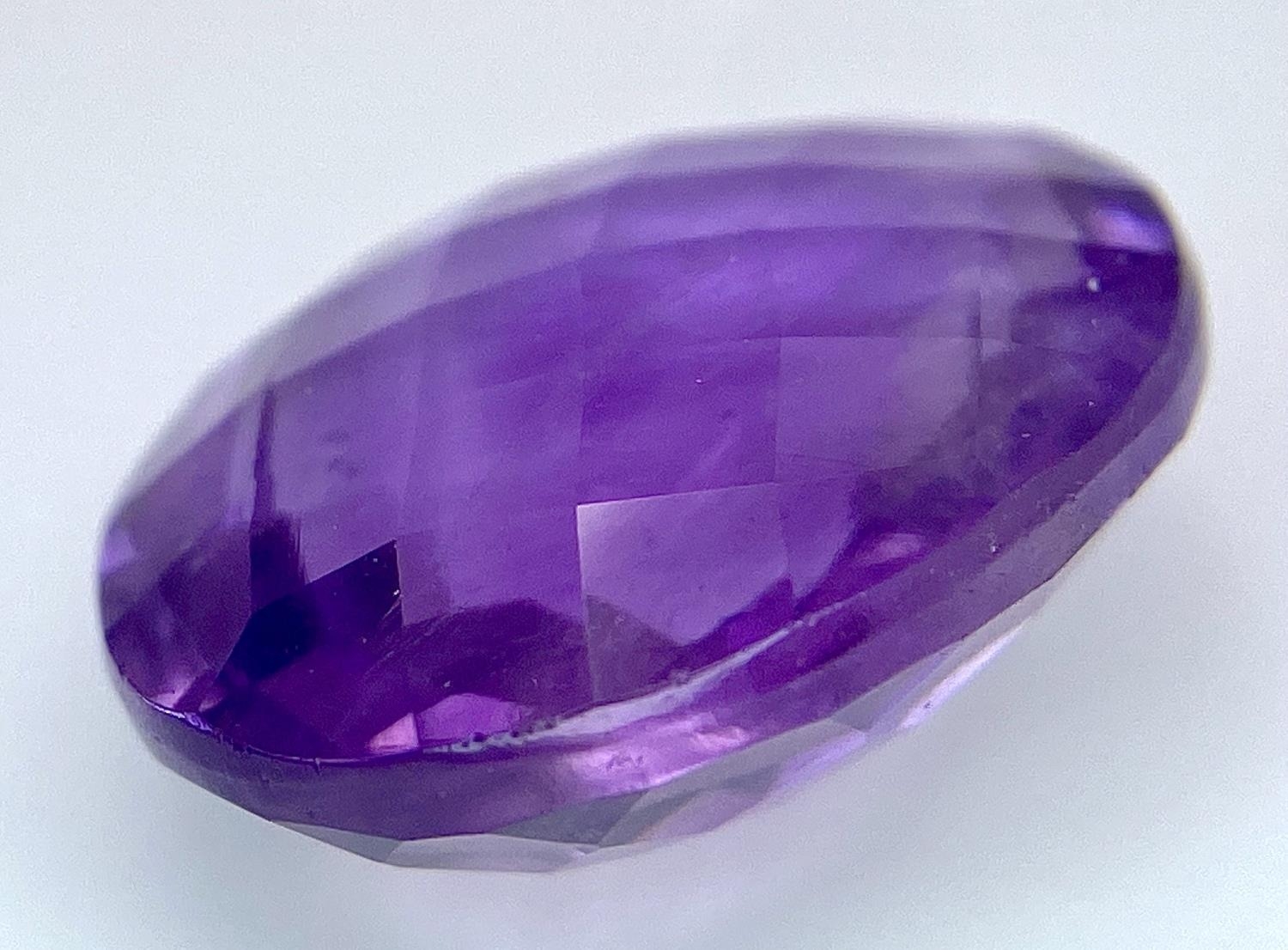 An 11.60ct Oval Faceted Amethyst - IDT Certified. - Image 2 of 5