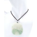 A Dragon Jade Pendant on an Adjustable Necklace. 5.5cm length. 25g total weight.