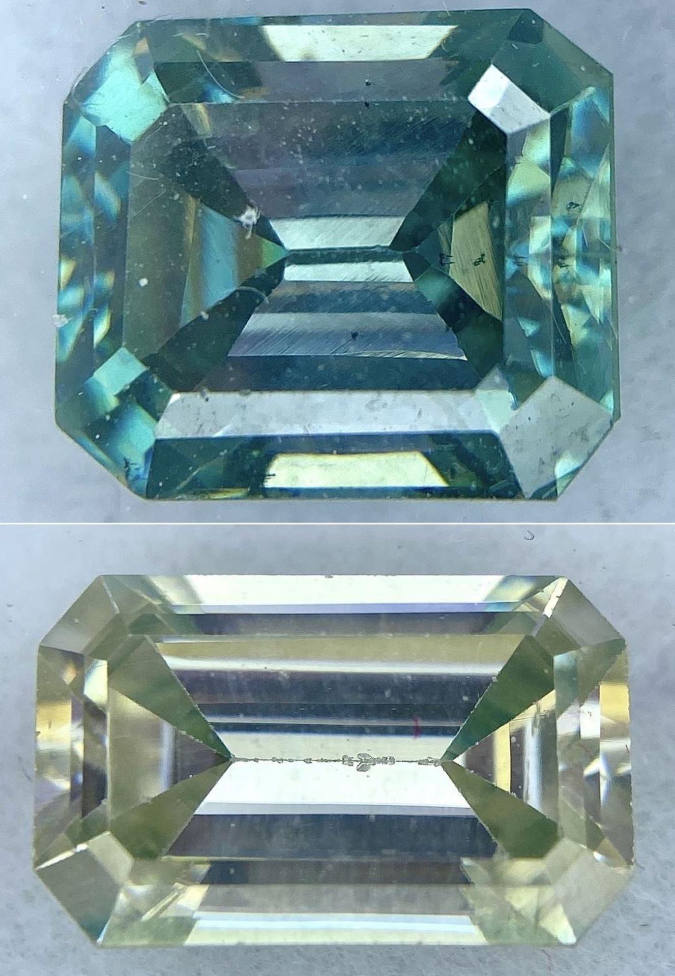 A Collection of 2 Moissanites 3.760ct and 4.220ct - emerald cuts. Both in sealed containers with GLI