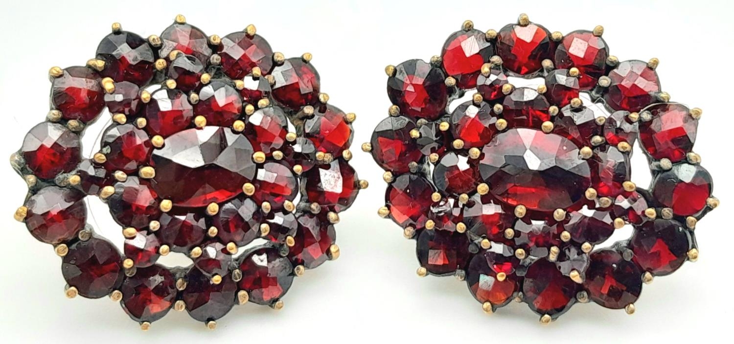 A Pair of Vintage Garnet Earrings. Yellow metal.