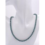 An Emerald Round Cut Tennis Necklace. Set in 925 Silver. 44cm length. 50g total weight. Ref: CD-1312