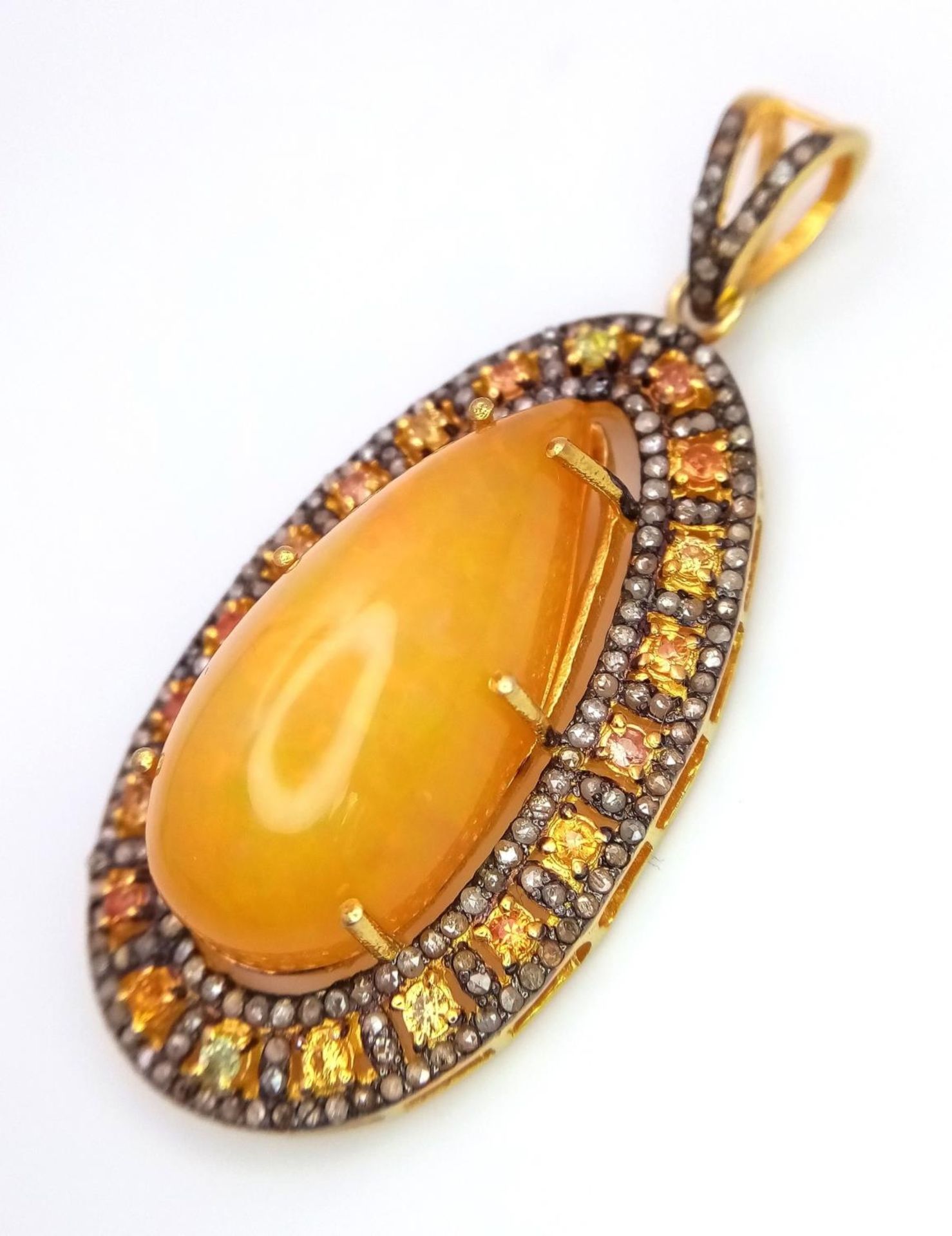 An Australian Fire Opal Pendant with Yellow Sapphires and Old Cut Diamond Surround set in Gilded 925 - Image 2 of 4